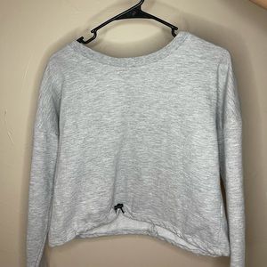 Women’s grey sweater size medium. From the brand Almost Famous.